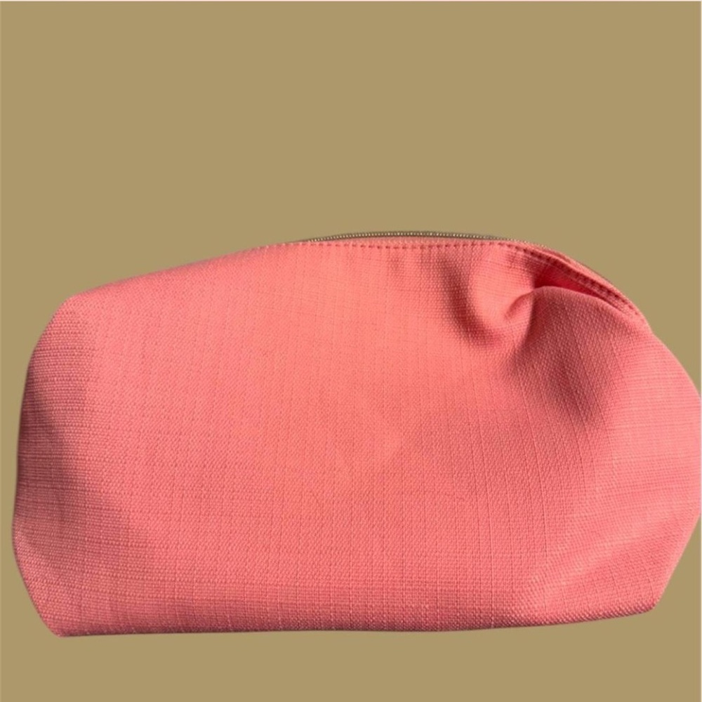 Lancôme pink makeup or self care bag 
Toiletry bag
